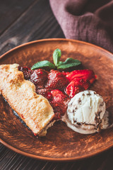 Slice of strawberry galette with ice-cream