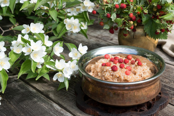 Spelled porridge with strawberries for breakfast.