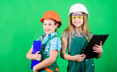 Future profession. Child care development. Builder engineer architect. Kid worker in hard hat. Tools to improve yourself. Repair. small girls repairing together in workshop. they can fix anything