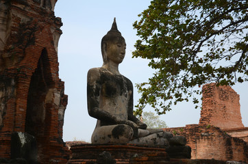 old Buddha statue in temple at Wat Yai Chai Mongkol at Ayutthaya, Thailand. World Heritage Site