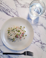 plate of food, rice with peas and bacon