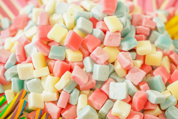 delicious multi-colored fruit marmalade. unhealthy bright candies in bulk. different jelly photo close. tasty sweets in the candy shop. nobody. 