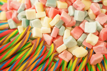 delicious multi-colored fruit marmalade. unhealthy bright candies in bulk. different jelly photo close. tasty sweets in the candy shop. nobody. 