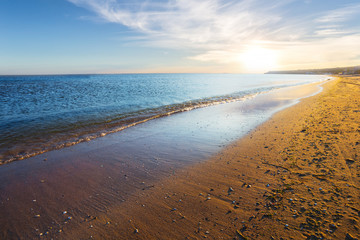 sandy sea beach at the sunset, evening sea landscape