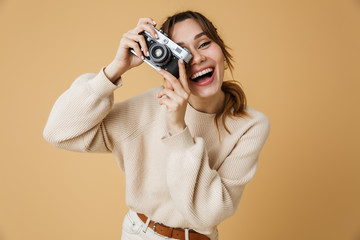 Attractive young woman wearing sweater standing