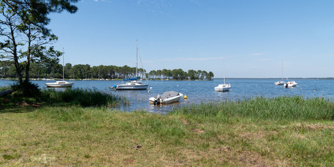 Fototapeta na wymiar Lake with Boat in Lacanau in France southwest in web banner template