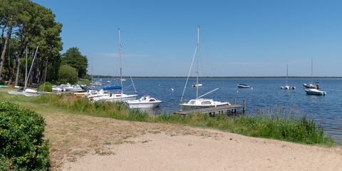 lake in Lacanau France with boat in web banner template