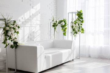 Fototapeta na wymiar Beautiful interior room with a sofa. Minimalism. Concept design, renovation, housing, home