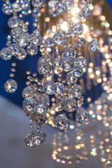 Glass faceted hanging balls. The subject of interior decoration and space in the room. 