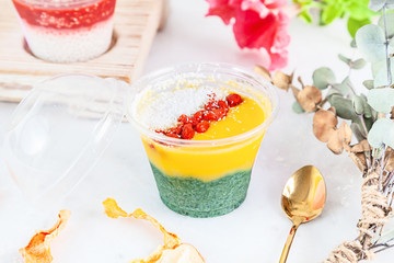 Close up on vegan Trifle dessert made with fruit mango spirulina. English cuisine. Close up...