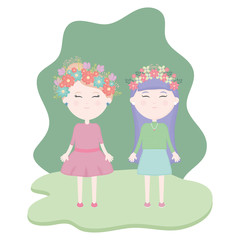 couple of cute girls with floral crown in the hair in the field
