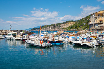 Fototapeta na wymiar Marina of Massa Lubrense, marine city near Sorrento, full of tourist boats in the summer season