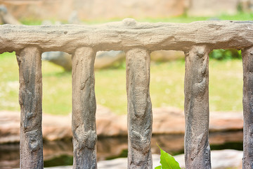 close-up of concrete fence in garden