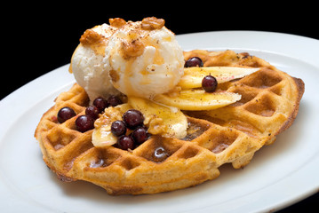 Gofre - belgian homemade waffles with ice cream, bananas and nuts