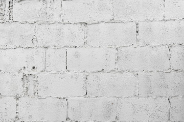 Obraz premium closeup of white decay brick wall abstract background wallpaper or web banner with copy space.