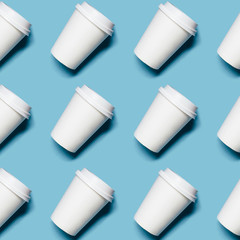 Pattern with lot of paper cups for coffee or tea on blue background.