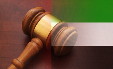 United Arab Emirates legal and law concept, judge gavel on table and uae flag 