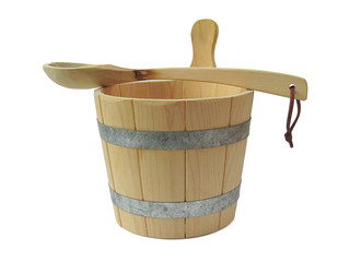Wooden sauna spoon lying on a wooden sauna bucket against a white background © JanWillem