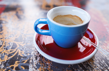 Blue cup of coffee espresso on the table