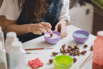 Artisan woman making handmade gemstone jewelry