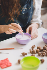Artisan woman making handmade gemstone jewelry
