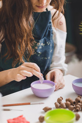 Artisan woman making handmade gemstone jewelry