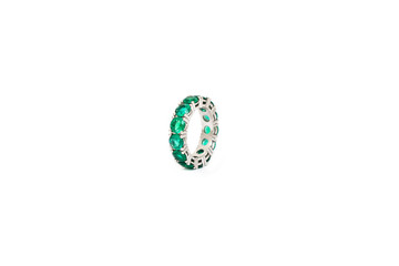 Diamond ring with green precious gems. White golden ring on white background. Fashion luxury accessories