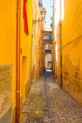 Fototapeta premium Colorful houses in the alleys of the town of Bosa in Sardinia in sunlight in spring