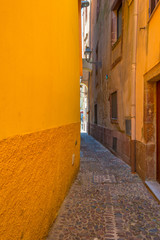 Colorful houses in the alleys of the town of Bosa in Sardinia in sunlight in spring
