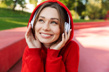Smiling young woman wearing hoodie