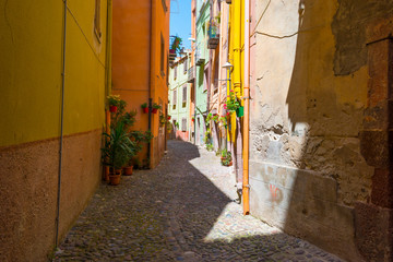 Colorful houses in the alleys of the town of Bosa in Sardinia in sunlight in spring