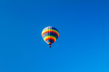 Fototapeta na wymiar Colorful hot air balloons over blue sky.