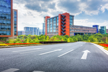 Clean lawn and tidy oak trees along the walk path through the ty