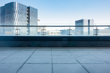 Fototapeta na wymiar Roof top balcony in the building with cityscape background