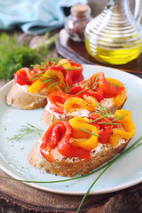 Vegetable appetizer. Slice of bread, cream cheese and grilled bell pepper with olive oil