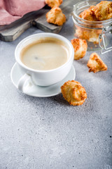 French coconut cookies congolais with coffee mug, grey stone or concrete background copy space