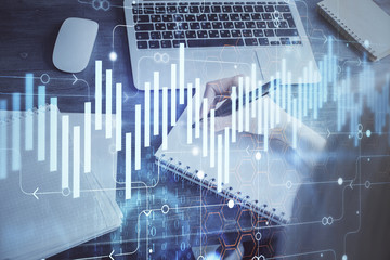Forex chart displayed on woman's hand taking notes background. Concept of research. Multi exposure