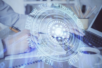 Fototapeta premium Businessman working on Laptop with technology theme drawing. Concept of big data. Double exposure.