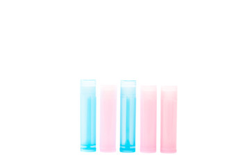 pink and blue bottles with medicine isolated on white