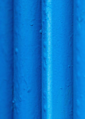 Many old blue pipes. Pipeline used in different industry ways: gas, water or vapor supply. Close up