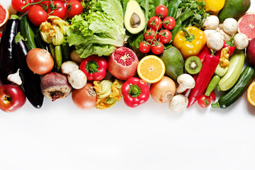 Clean healthy eating habits concept. Fruits, herbs, greens & vegetables mix, colorful juicy organic detox smoothie juice ingredients, white background. Vegan vegetarian diet food. Flat lay, copy space