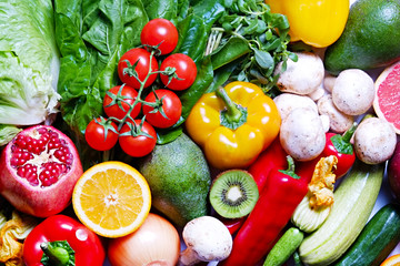 Clean healthy eating habits concept. Fruits, herbs, berries & vegetables mix, colorful juicy organic detox smoothie juice ingredients background. Vegan vegetarian diet food. Flat lay, copy space.