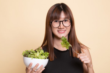 Healthy Asian woman with salad.