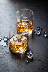 Glasses of whiskey with ice