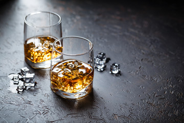 Glasses of whiskey with ice