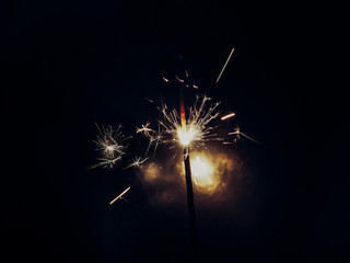 Blank background with bengal fire .Sparkler . New year party sparkler on black background