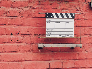 Ciak or clap board on a wall. Film movie titles. Abstract image for cinema. Can be applied to...