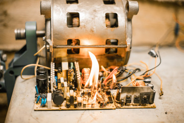 Overloaded electrical circuit causing electrical short and fire. Short circuit faults burnt...