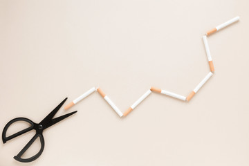 Top view scissors with cigarettes