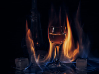 Fire on the wine glass, fire on the cocktail glass , vodka ice and fire